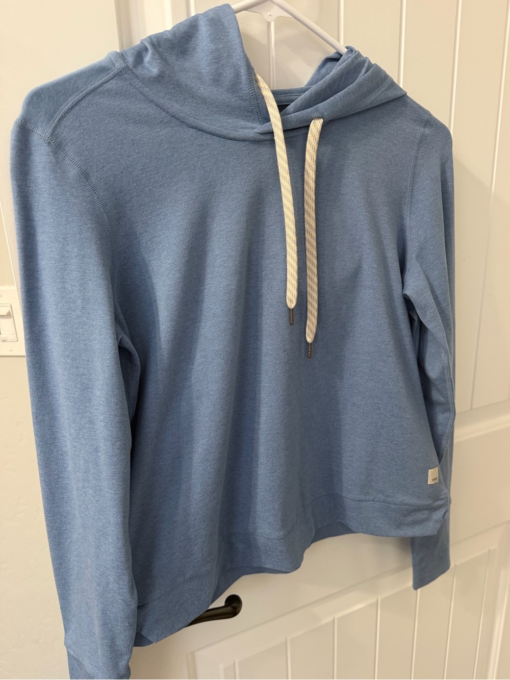 Vuori light blue pullover with cream logo patch